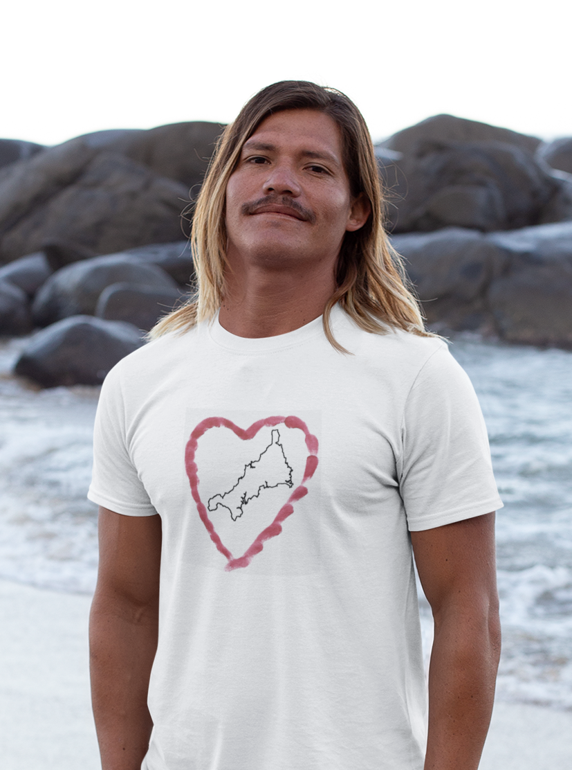 Man wearing Surf Shack Designs I Love Cornwall Kernow Heart t-shirt on rocky Cornish beach — Cornwall graphic tee collection