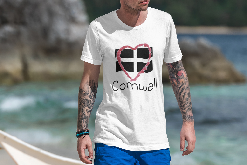 Close-up of hand-drawn heart Cornwall flag design with handwritten script on beach