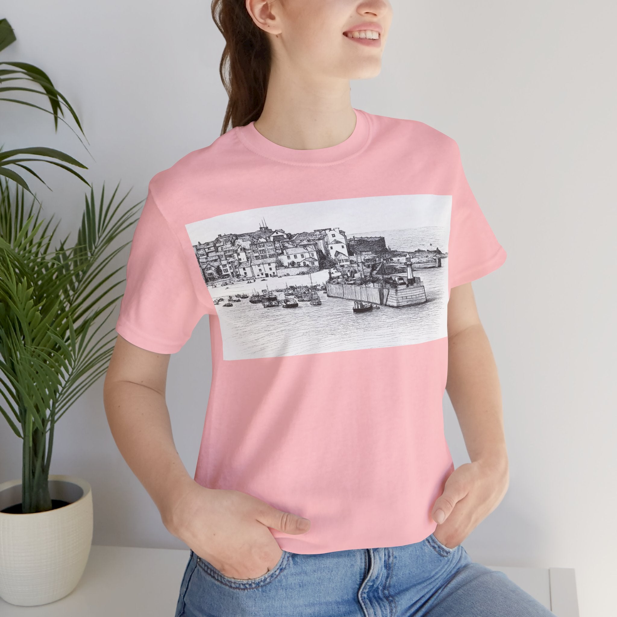 Holiday home woman wearing Pink St Ives Cornwall graphic t-shirt, seaside sketch tee