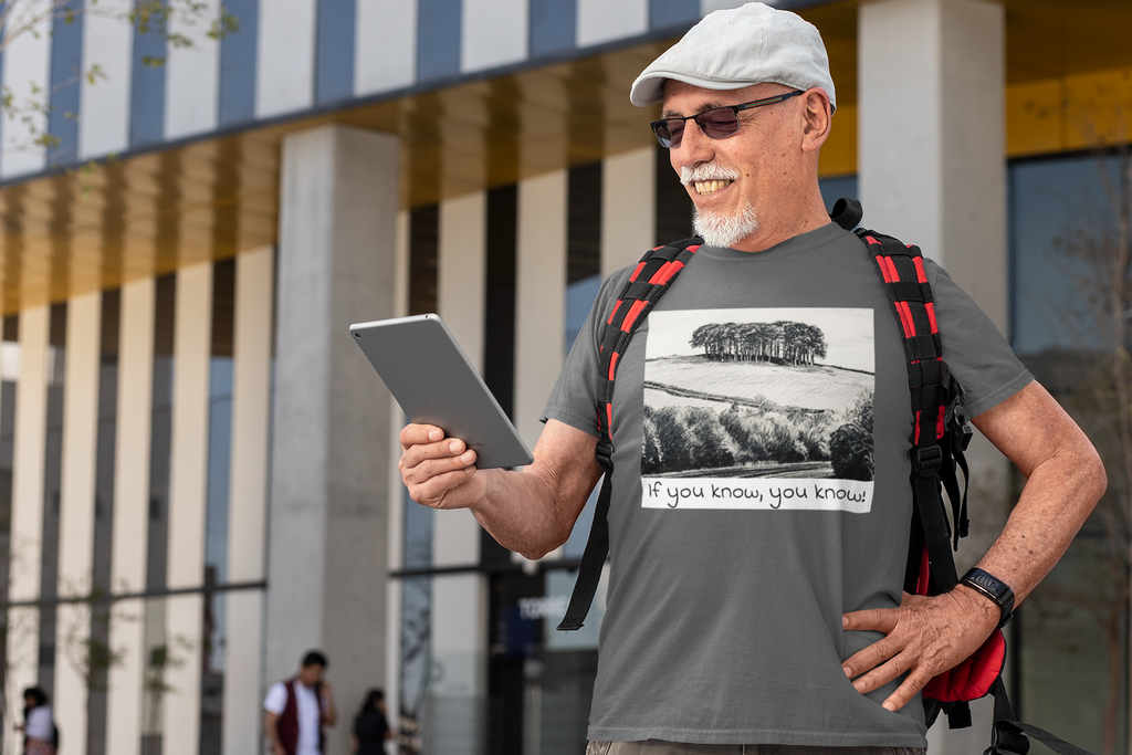 Man wearing Asphalt Nearly There Trees Cornwall t-shirt, coastal lifestyle photo