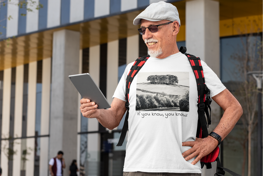 Man wearing White Nearly There Trees Cornwall t-shirt, coastal lifestyle photo