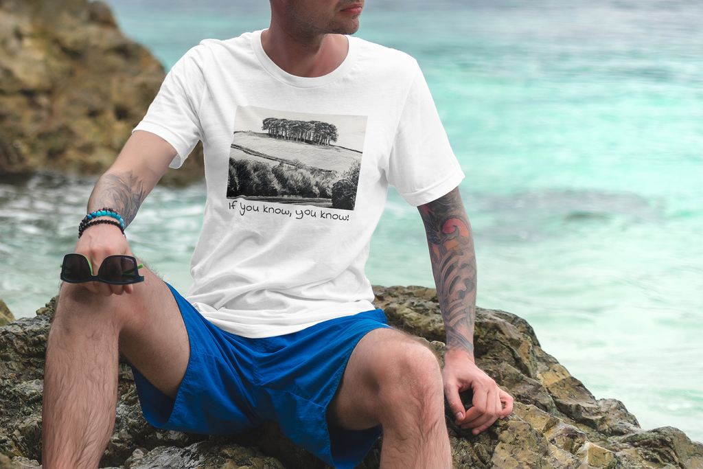 Model wearing White Nearly There Trees Cornwall t-shirt on the beach, holiday tee