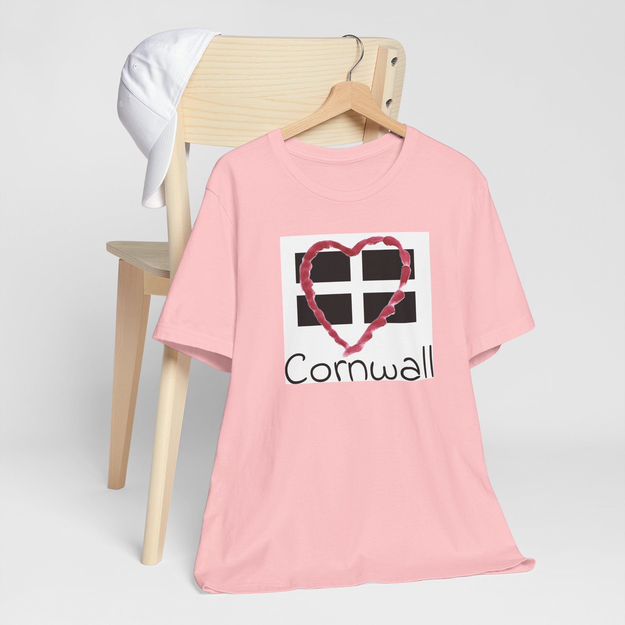 Pink Cornwall Heart Flag t-shirt on hanger, St Piran flag design tee