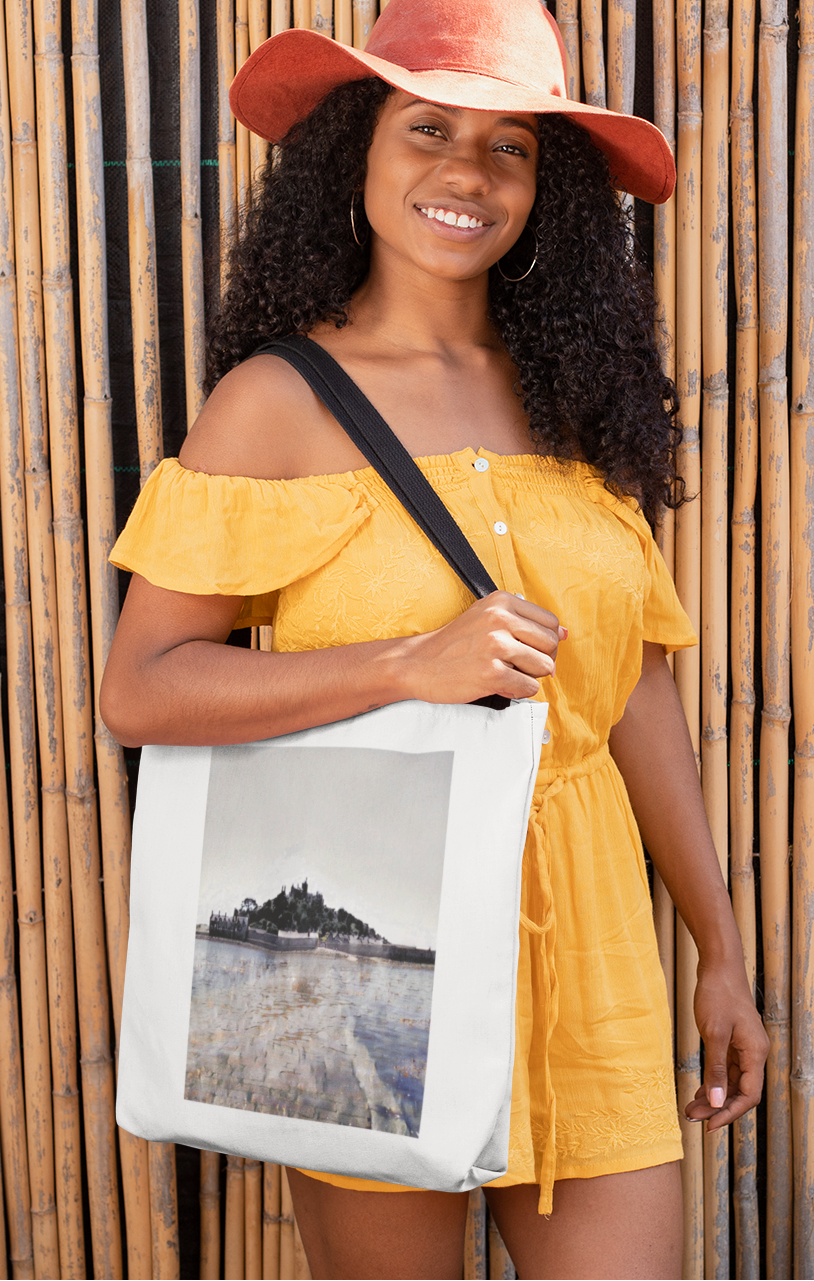 Woman carrying white St Michael's Mount tote bag over shoulder — Cornwall cotton shopper