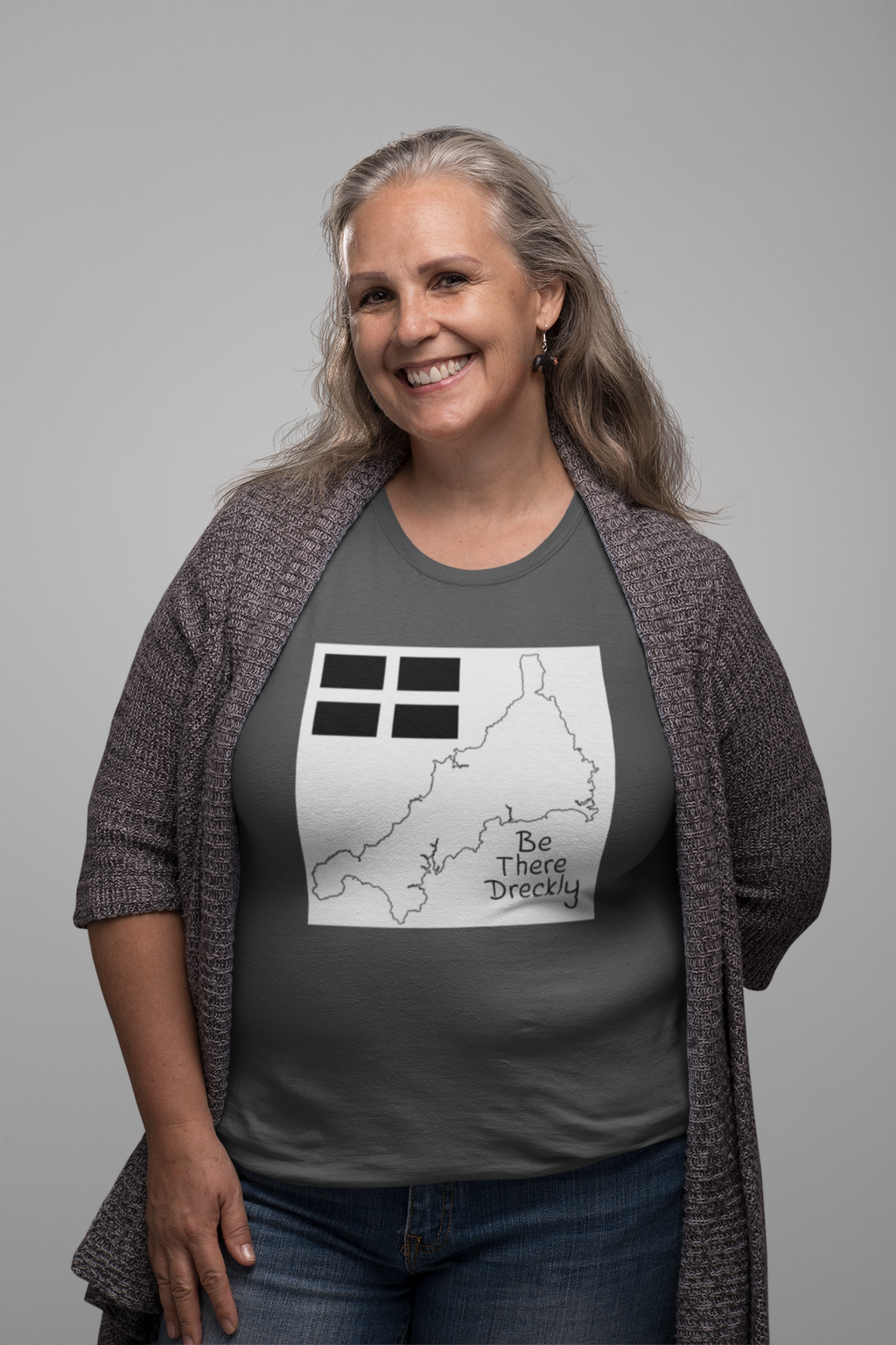 Woman wearing grey Be There Dreckly Cornwall map t-shirt, casual outfit