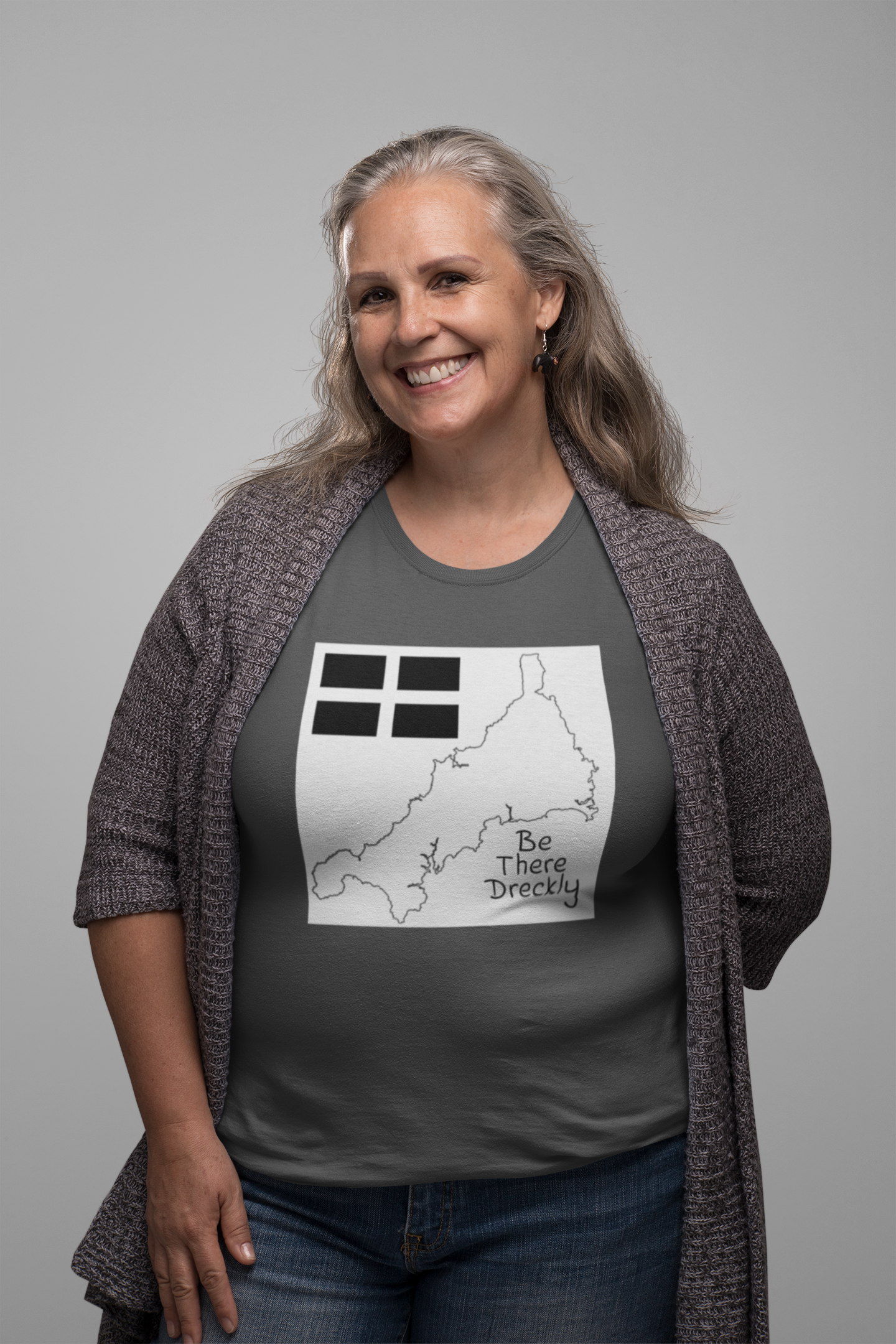 Woman wearing grey Be There Dreckly Cornwall map t-shirt, casual outfit