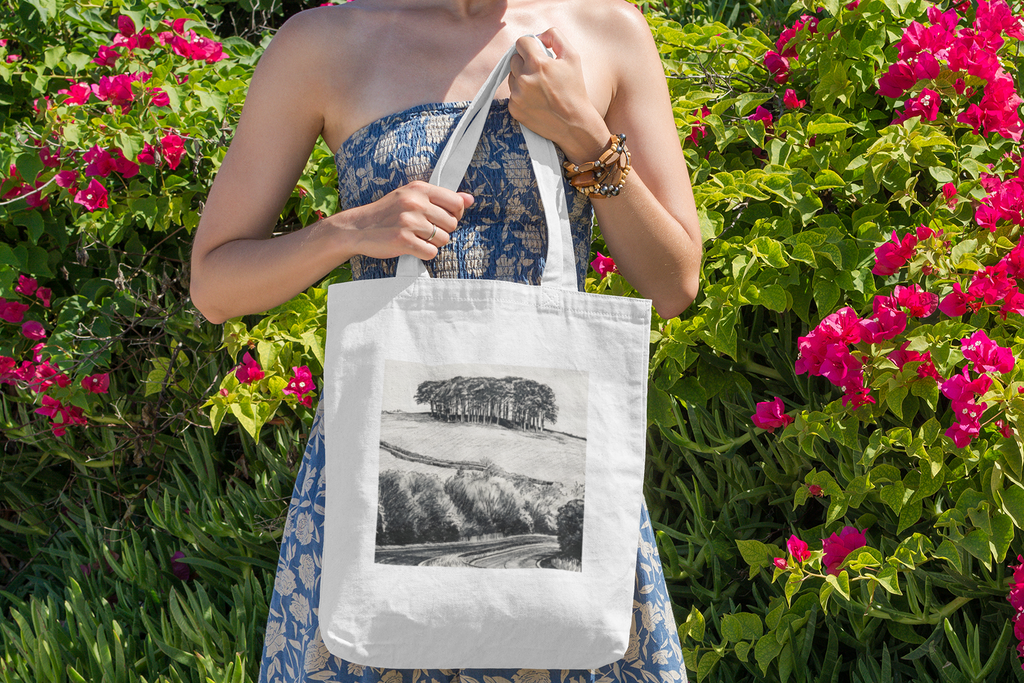 Woman with Nearly There Trees Cornwall tote bag near flowers, holiday gift bag
