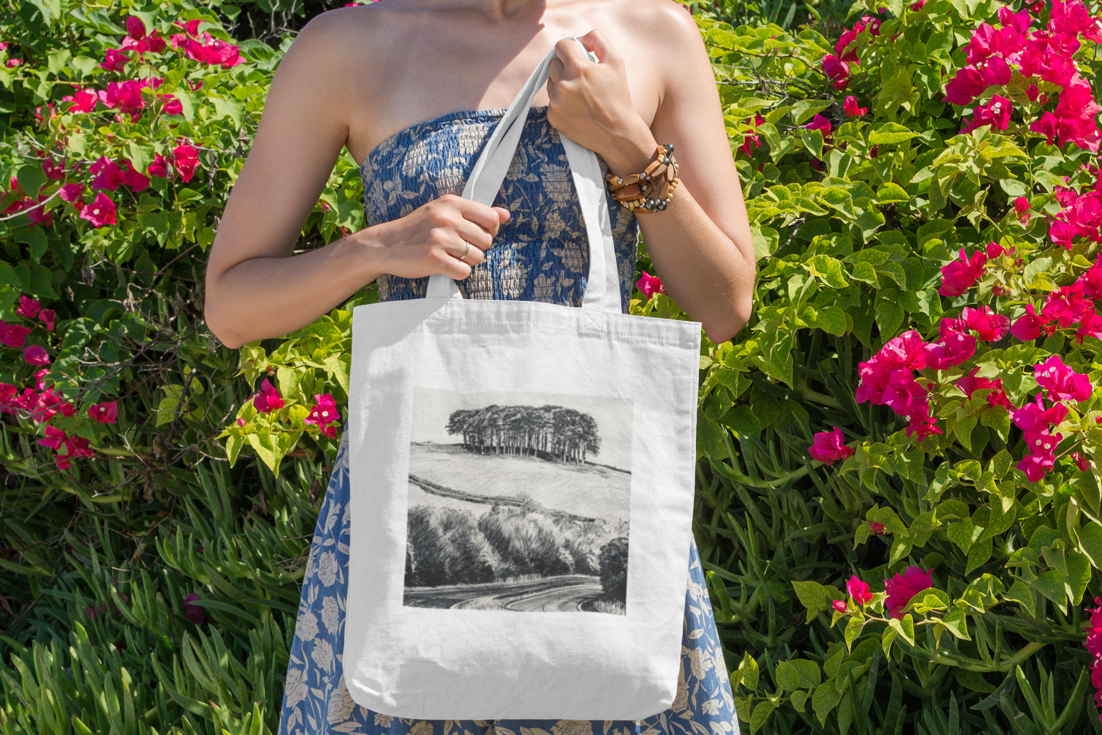 Woman with Nearly There Trees Cornwall tote bag near flowers, holiday gift bag
