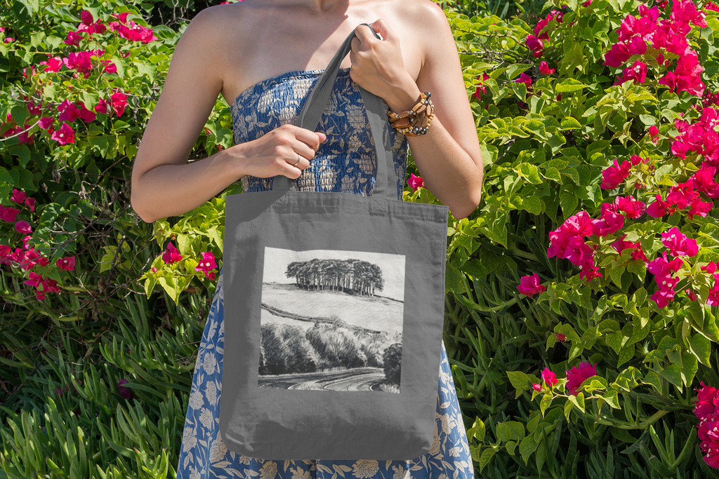 Woman with grey Nearly There Trees Cornwall tote bag near flowers, holiday gift bag