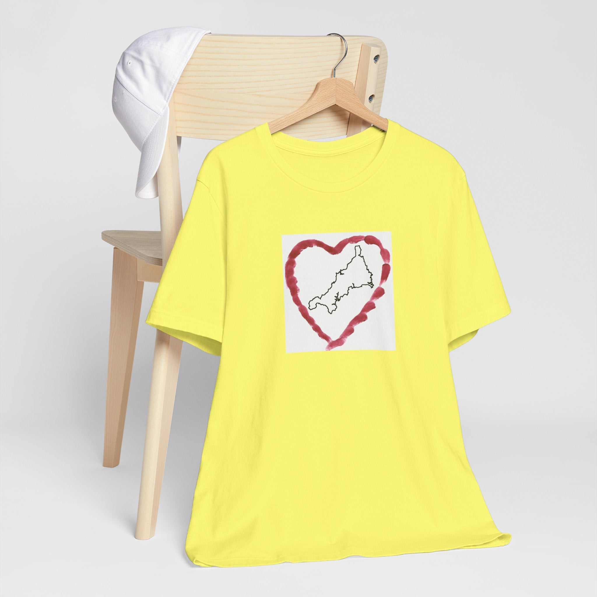 Yellow I Love Cornwall tee — Kernow heart graphic unisex shirt on hanger.