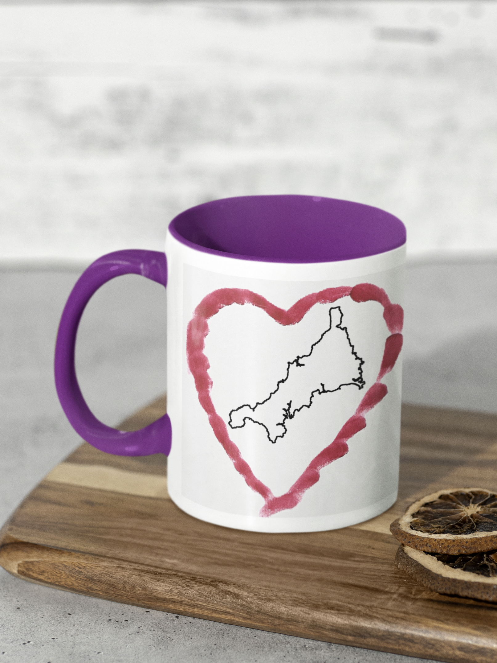 I Love Cornwall heart map mug with purple handle on wooden board, Cornwall outline design