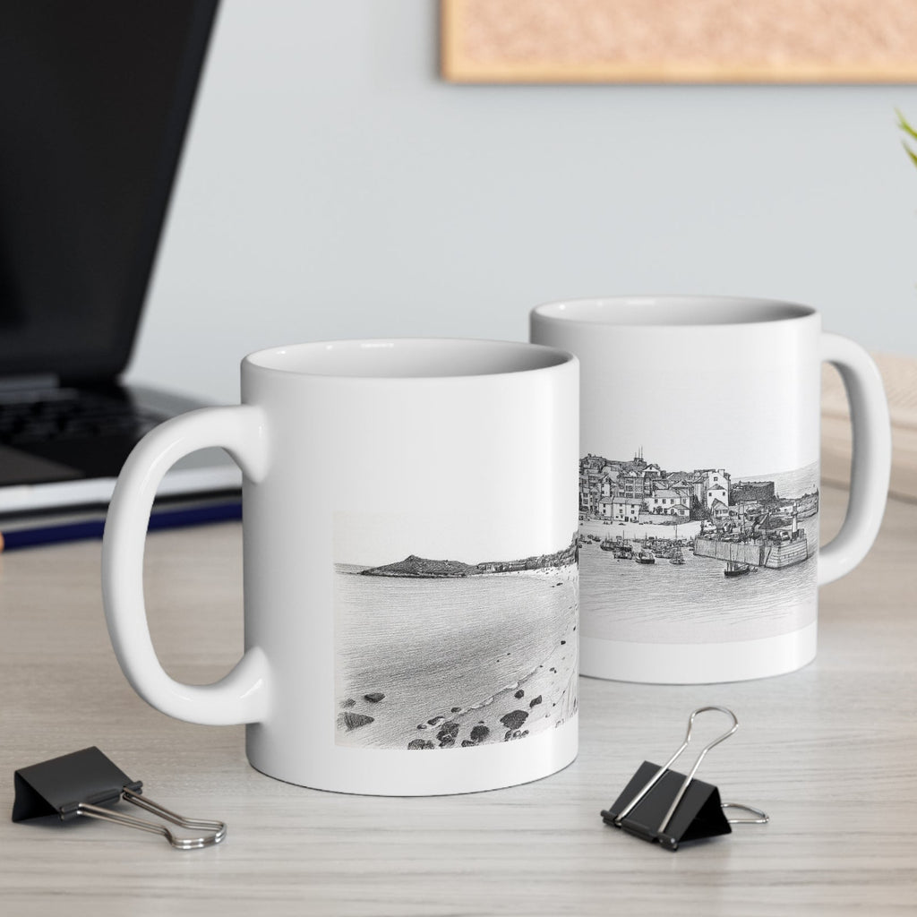 St Ives Cornwall mugs on desk styled with binder clips and laptop, beach and harbour sketch designs